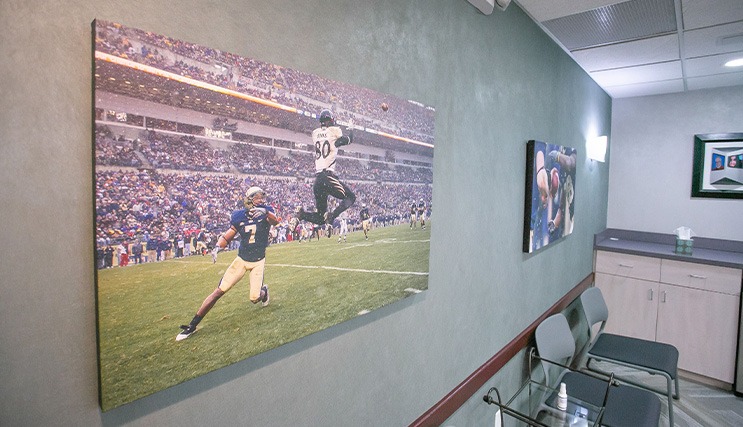 Photo of football players on dental office wall
