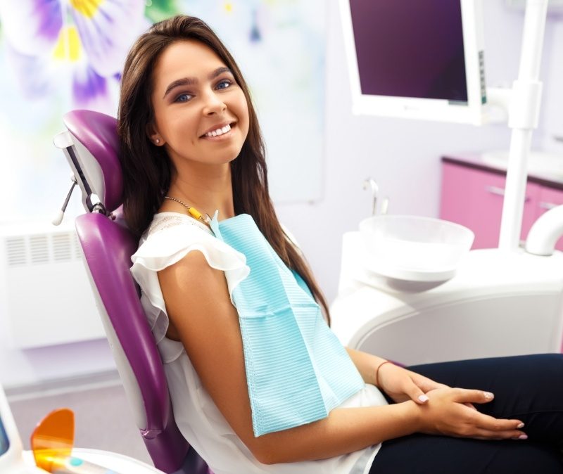 Smiling woman enjoying the health benefits of biocompatibility testing