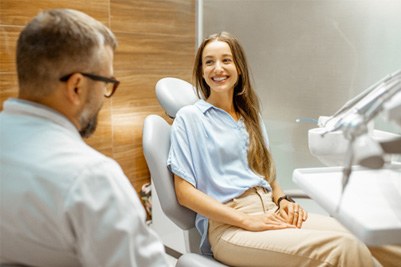 woman talking to cosmetic dentist 