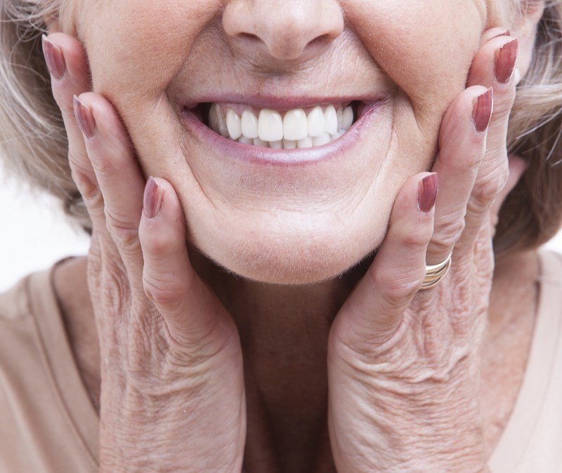 Closeup of flawless smile after dental implant tooth replacement