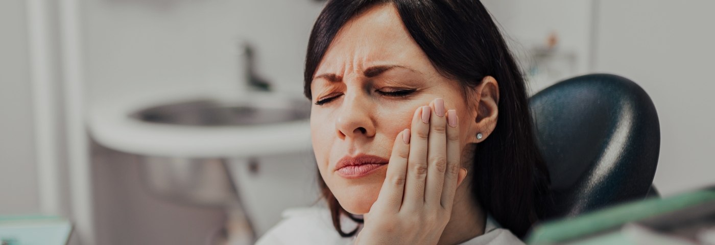 Woman in pain before emergency dentistry