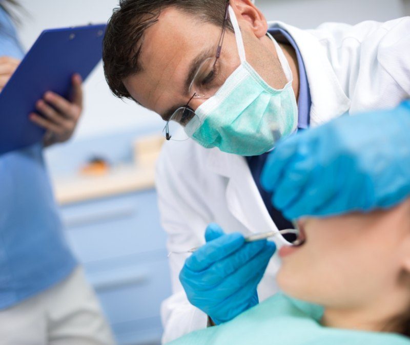 Dentist performing full mouth reconstruction