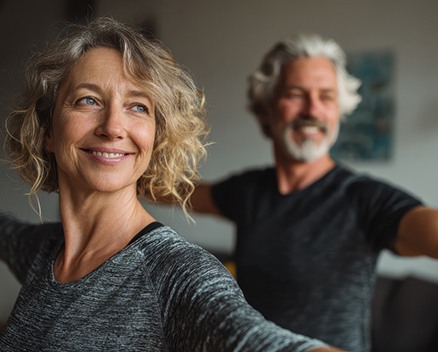 Older woman making heart shape with her hands