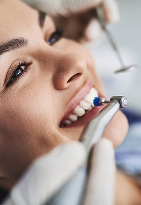 Woman having her teeth cleaned