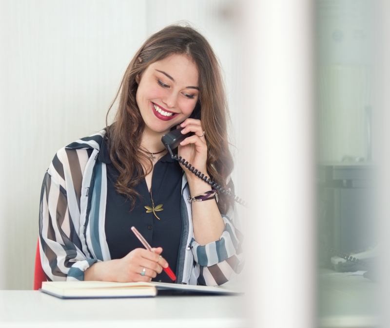 Woman calling to schedule a dental appointment