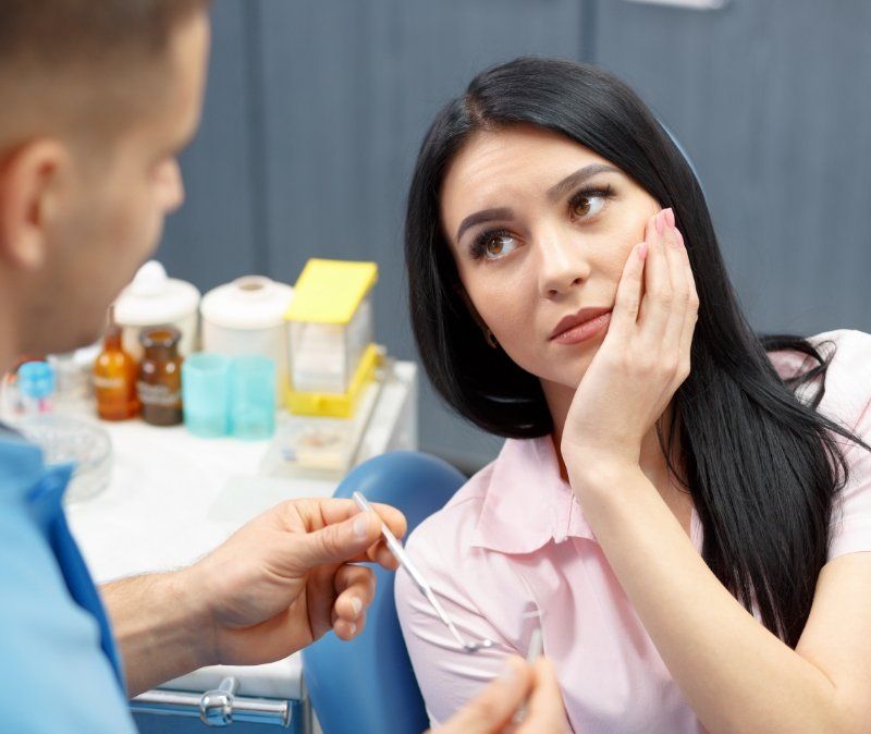 Woman in pain before emergency dentistry