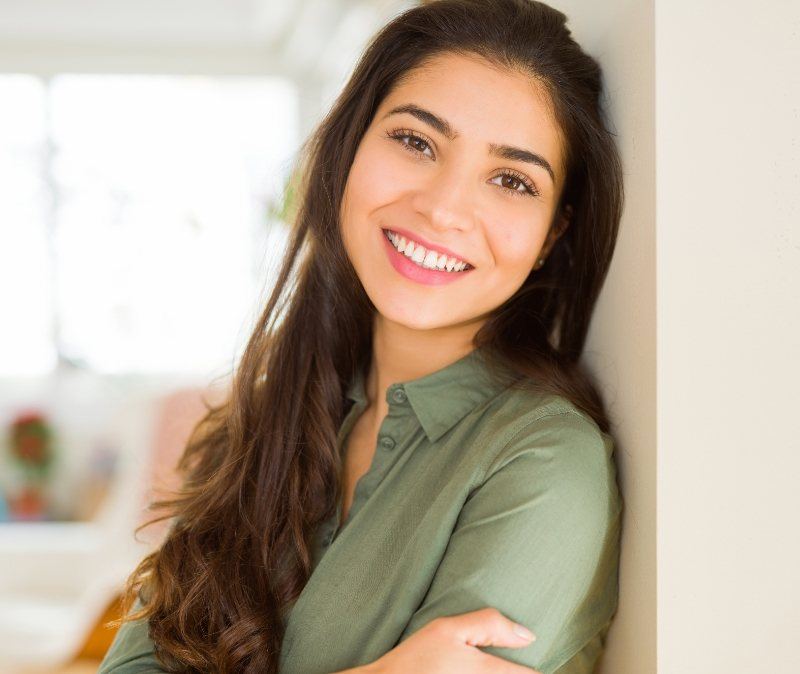 Woman sharing smile after full mouth reconstruction