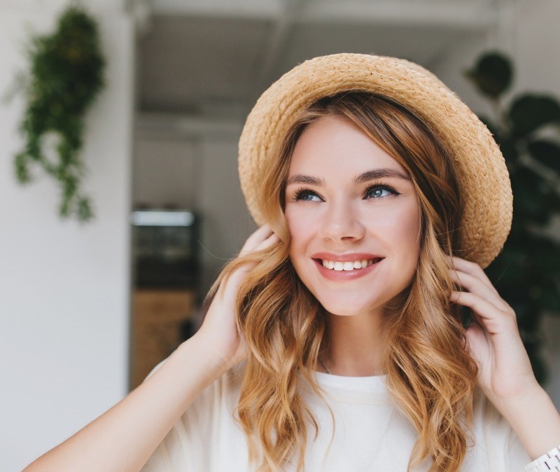 Smiling woman enjoying the benefits of veneers