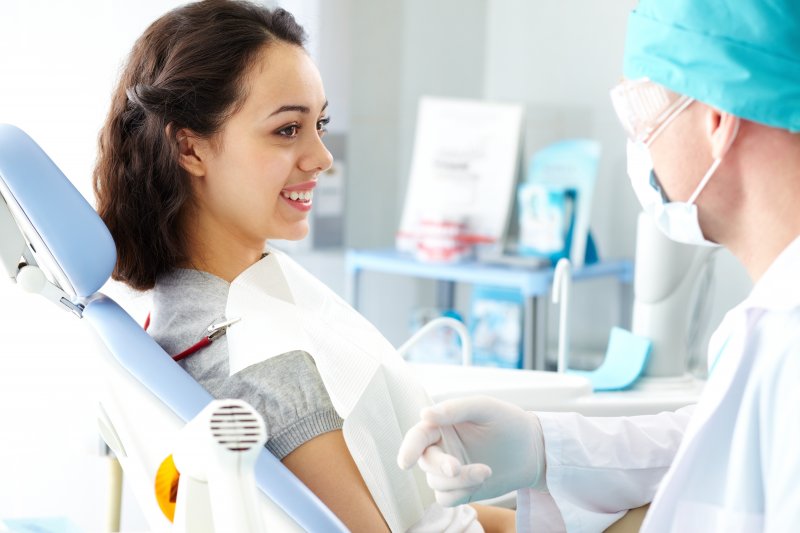 Dentist explaining ozone therapy to a patient