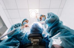 Dental team performing oral surgery 