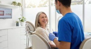 Happy patient talking with her dentist 